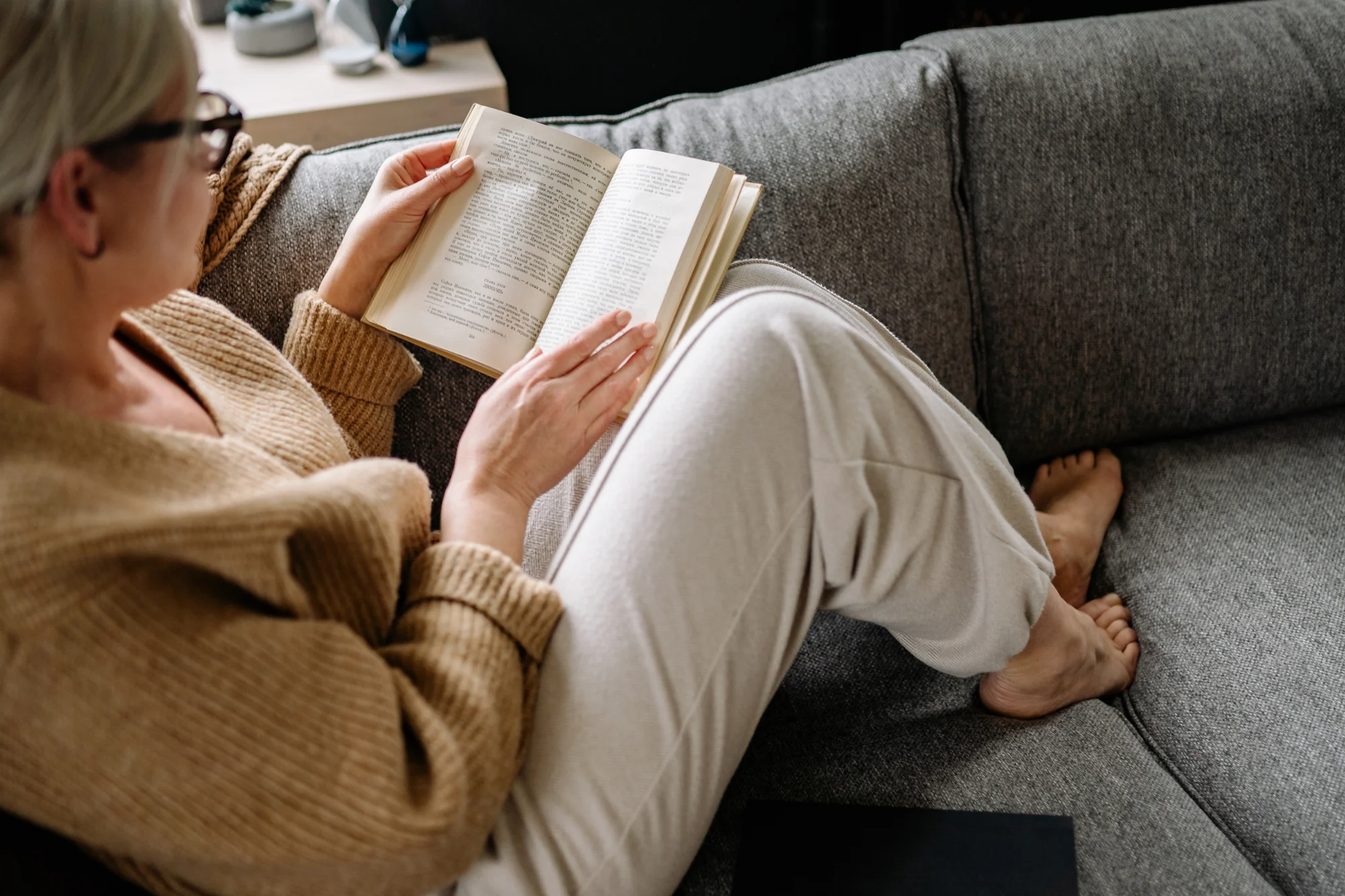 Woman reading on sofa